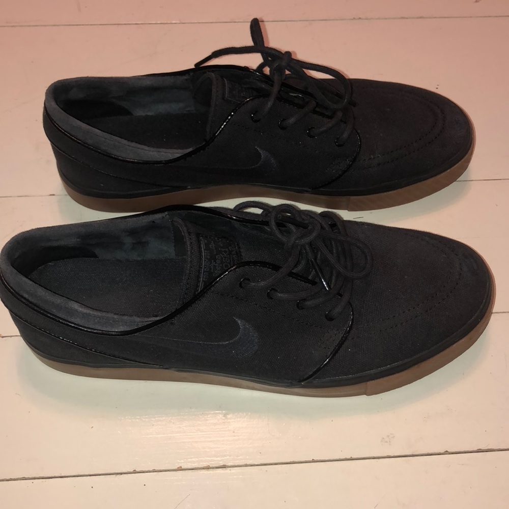 Black and brown Nike janoskis